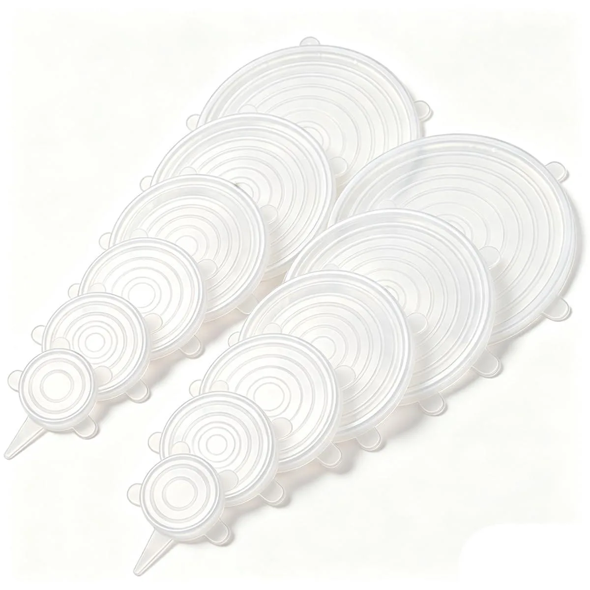 A set of twelve white silicone stretch lids in various sizes lying flat