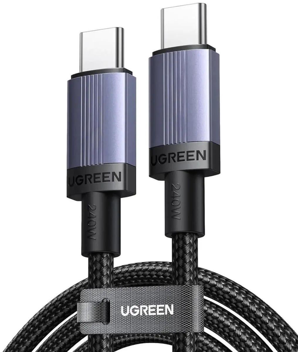 Two white USB-C cables coiled on a light surface