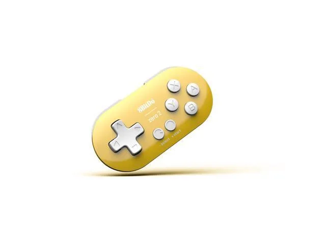 Tiny yellow rectangular gamepad with rounded edges, keychain-sized, matte finish