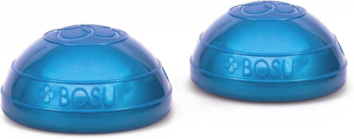 Two green half-dome balance pods on floor