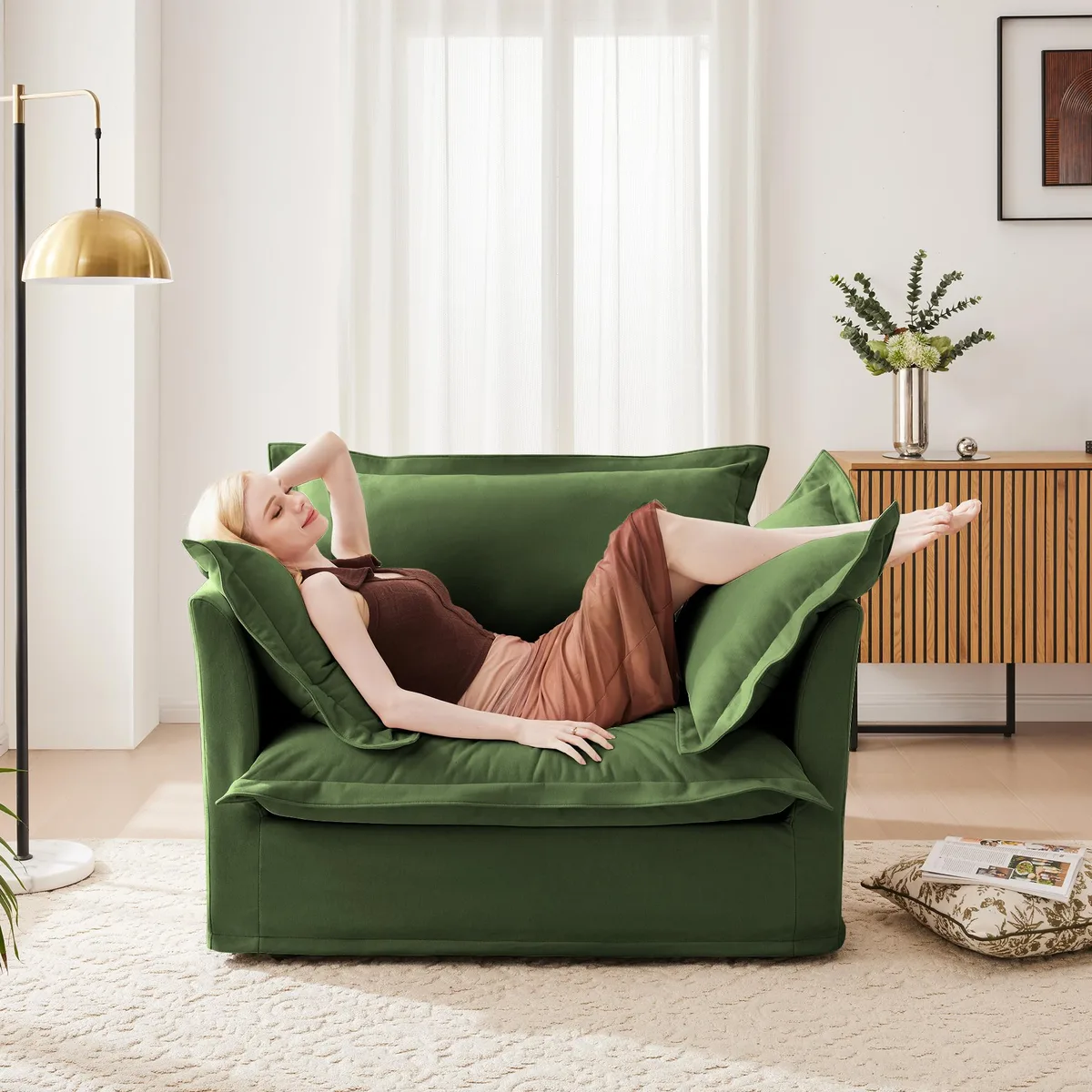 Green chenille slip-covered armchair with large back cushion and two toss pillows