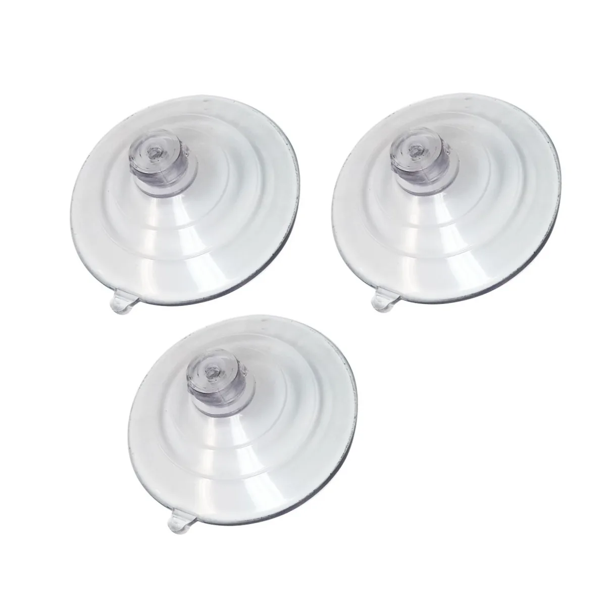 Three suction cups with pull tabs and alcohol wipes on a clean surface