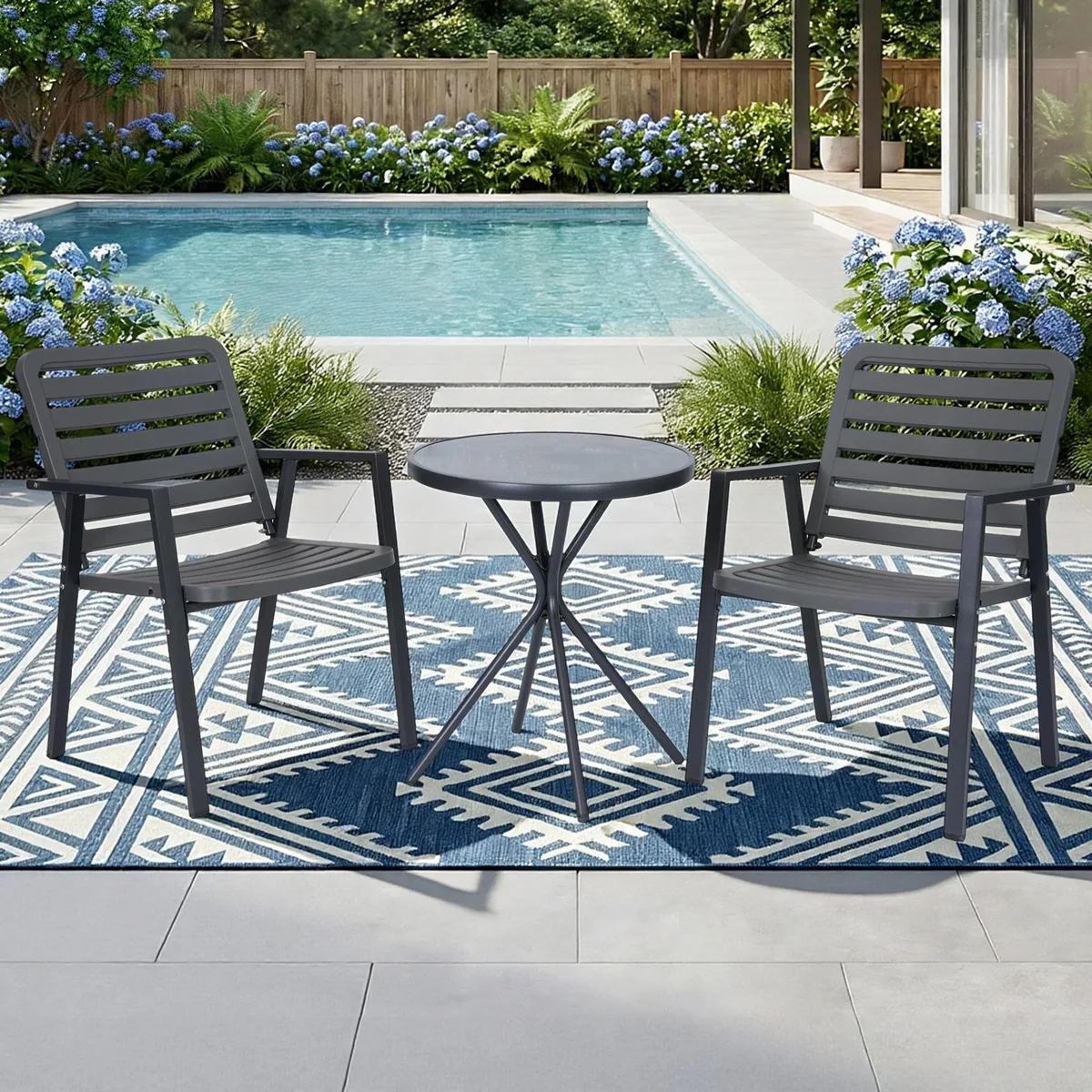Grey three-piece bistro set with round glass-top table and two matching chairs with contoured PP seats and metal frames