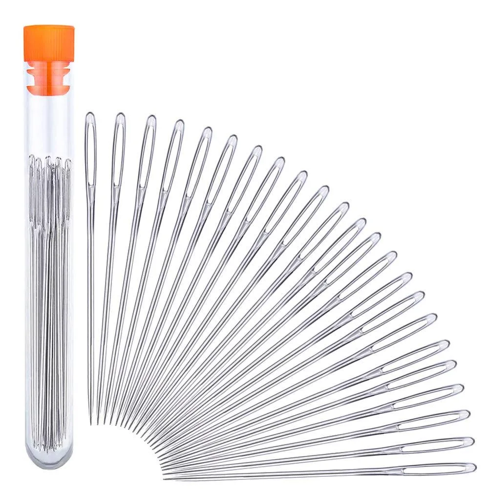 Twenty-three stainless steel needles with large eyes in a clear plastic bottle