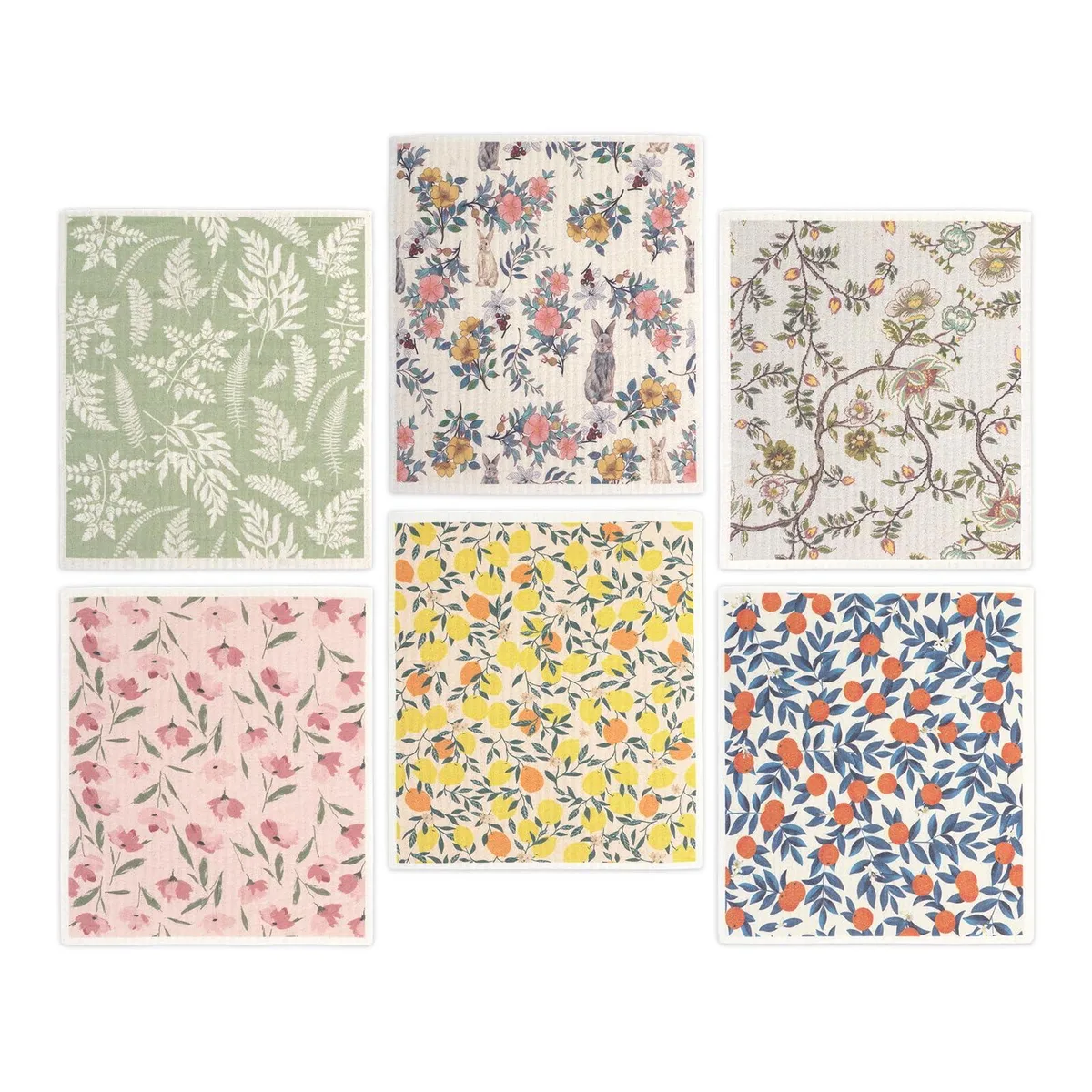Six thin rectangular cloths in fruit and flower patterns lying flat
