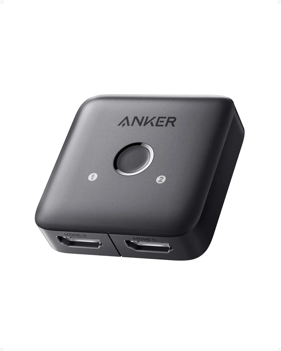 Small black HDMI switch with smooth finish and single button