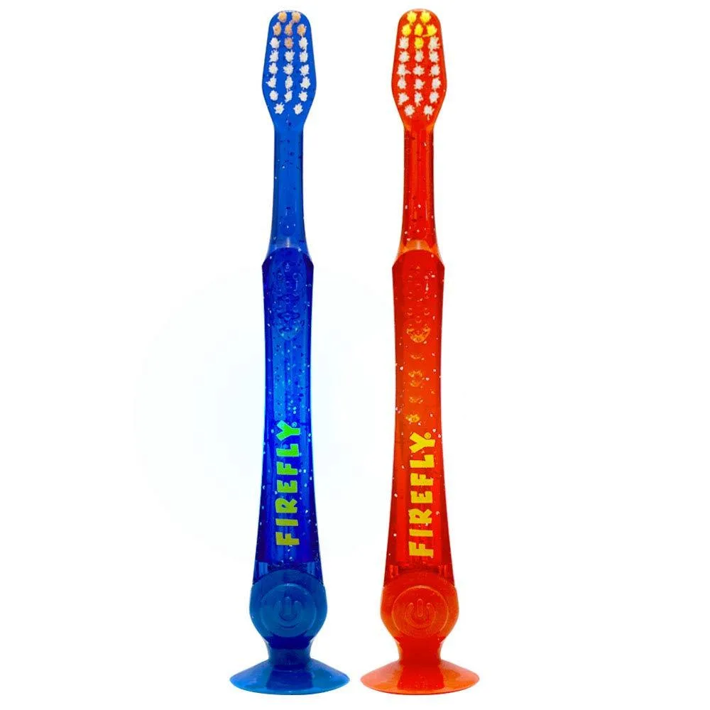 Two light-up kids toothbrushes with suction bases and soft bristles