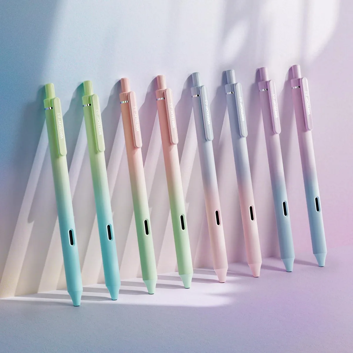 Eight retractable gel pens with gradient barrels and black ink tips
