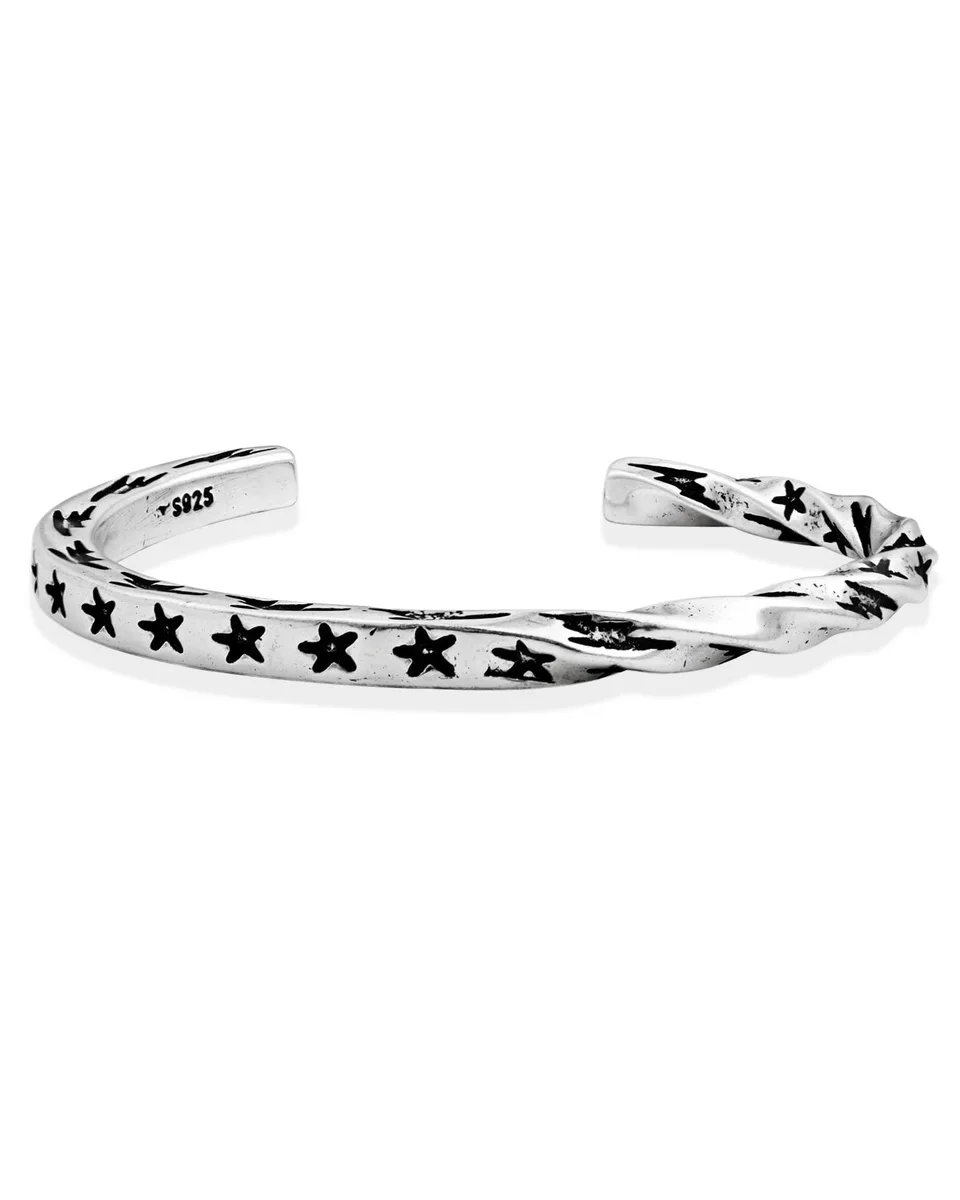 Sterling silver open cuff bracelet with twisted band and black star motifs