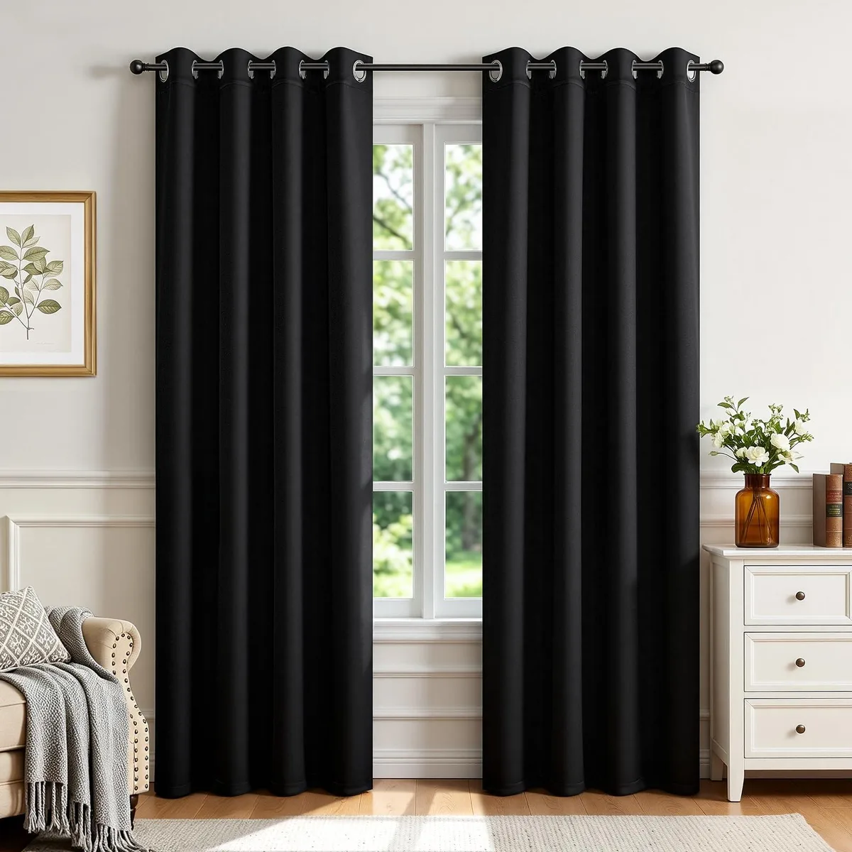 Two black polyester curtain panels with silver grommets, 52 by 84 inches