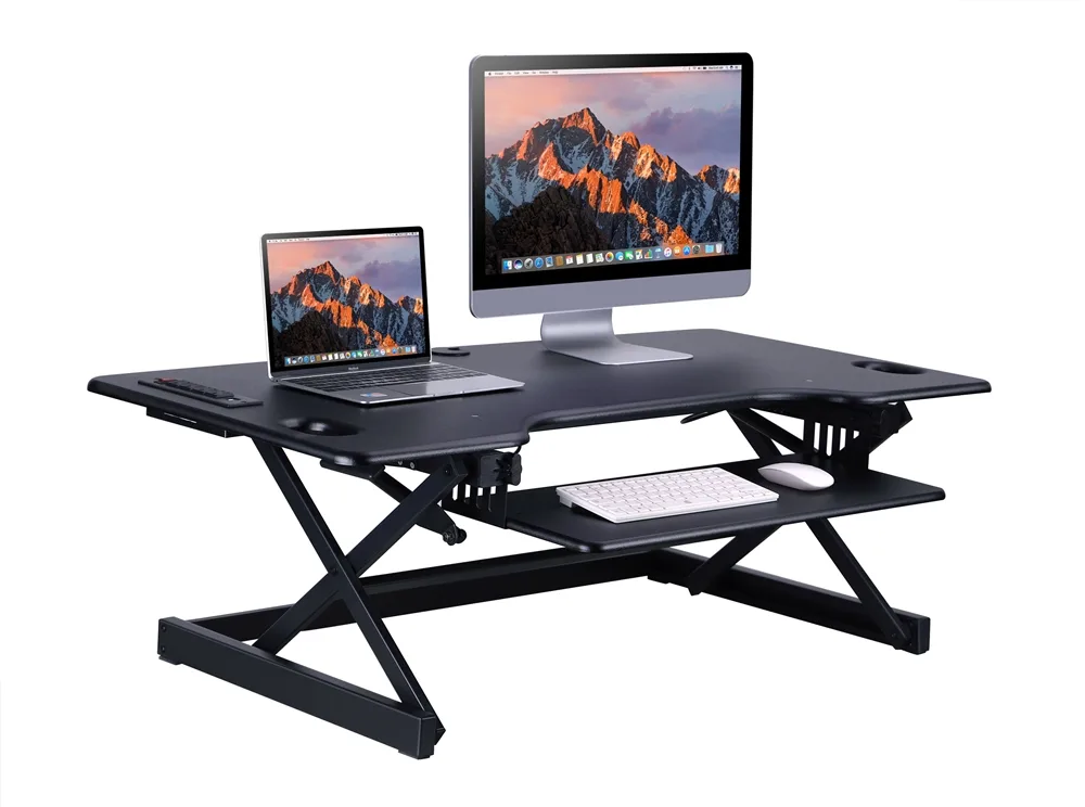 Black 46-inch sit-stand desk riser with USB and AC ports