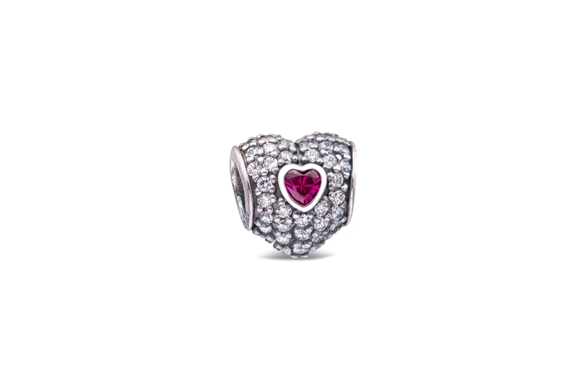 Heart-shaped sterling silver charm with 82 pave-set cubic zirconia and two bezel-set synthetic rubies