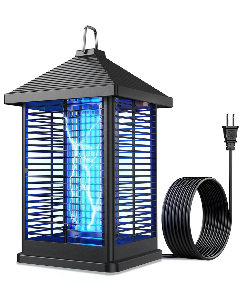 A rectangular white bug zapper with a UV light tube and protective grid, hanging by a chain on a dark background