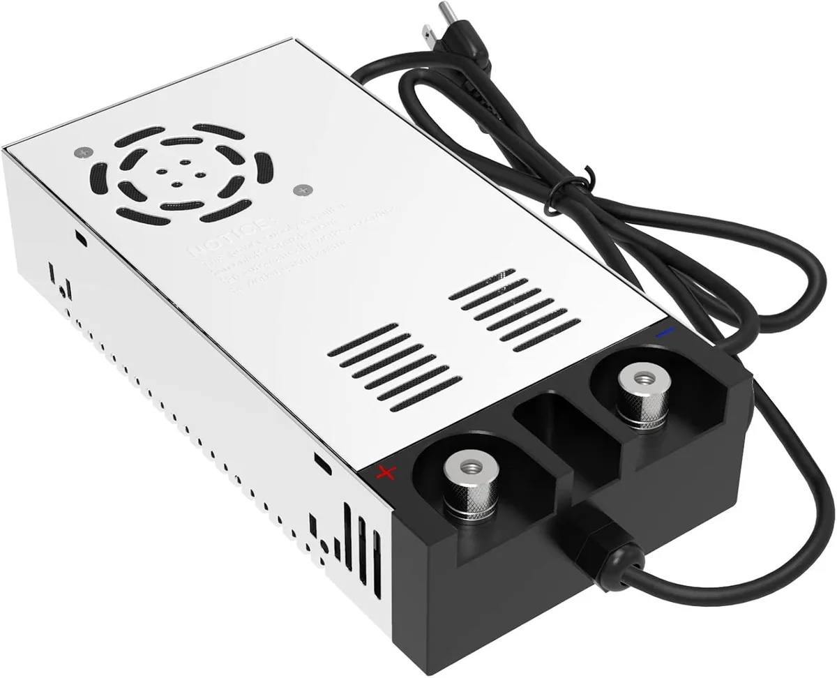 Rectangular aluminium power supply with cooling fan, heat-dissipation holes and anti-skid feet