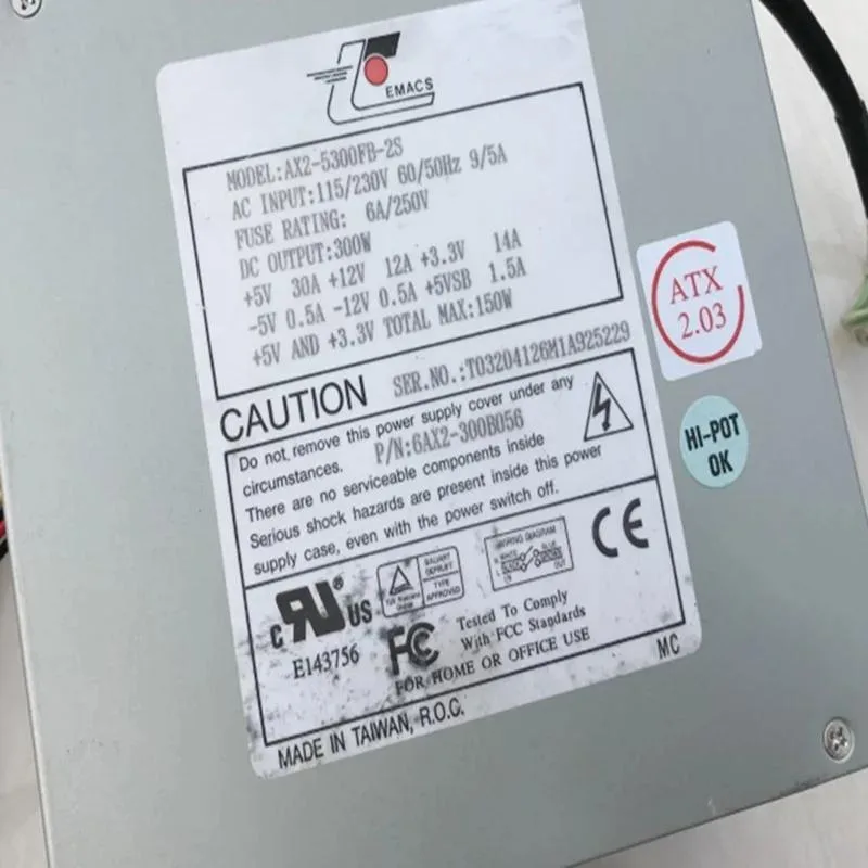 Rectangular ATX power supply unit with matte black metal casing and cooling fan grille