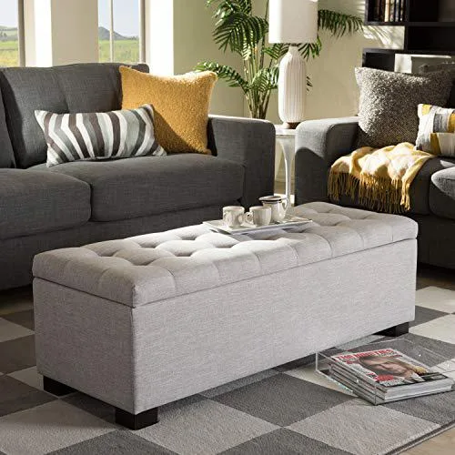 Greyish beige grid-tufted storage ottoman bench with black wooden legs