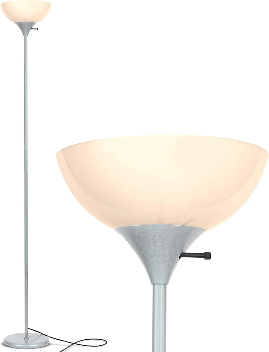 Tall platinum silver floor lamp with white plastic dome shade and weighted base
