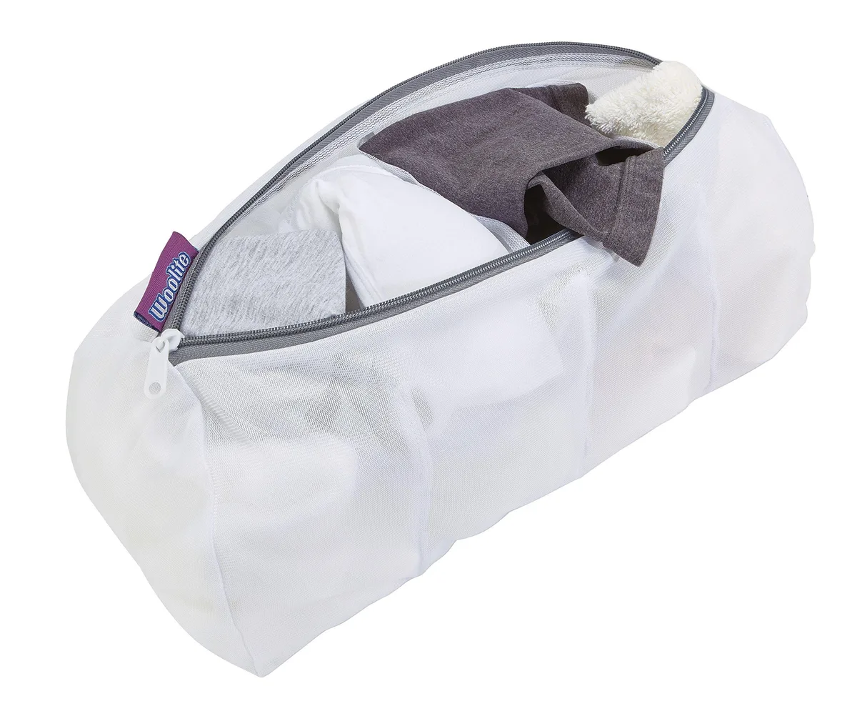 White mesh wash bag with four internal compartments and zip closure