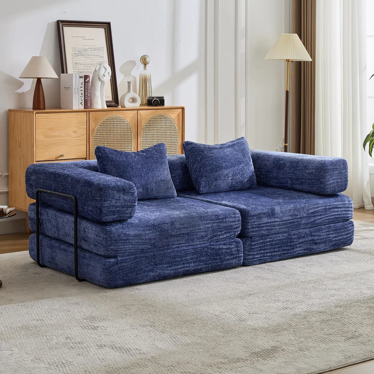 Dark blue chenille convertible floor sofa bed, folded flat with visible armrests