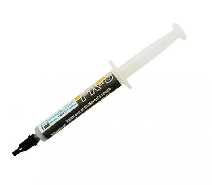 Small white syringe of grey thermal paste with grey cap