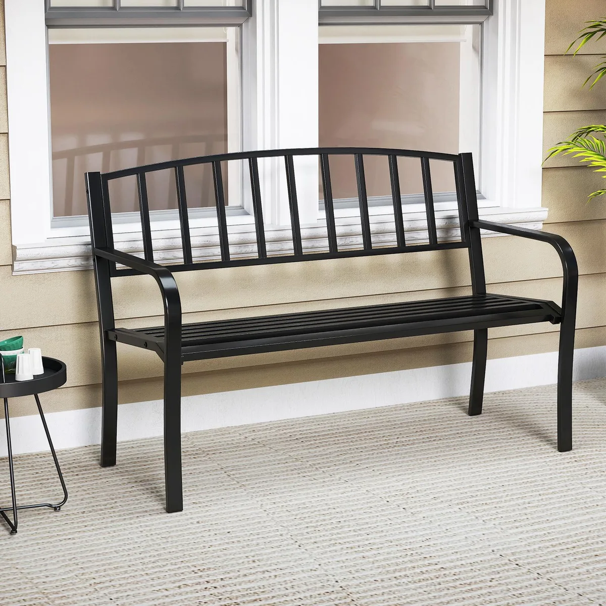 Black metal garden bench, slatted backrest, curved armrests, 50 inches long