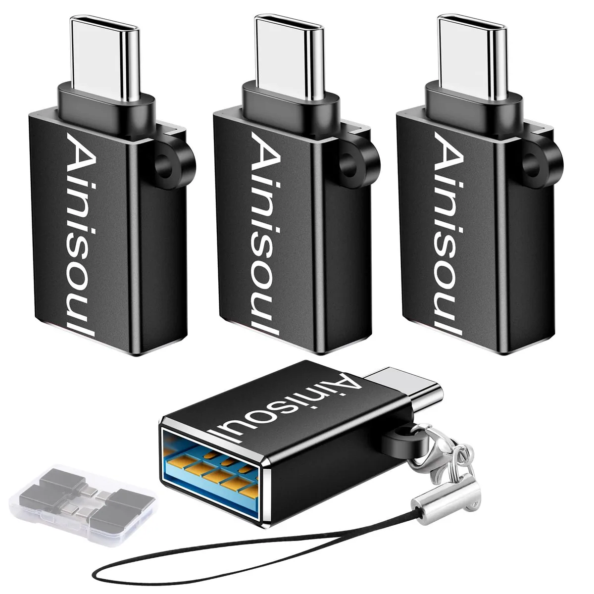 Four small black USB-C to USB-A adapters side by side