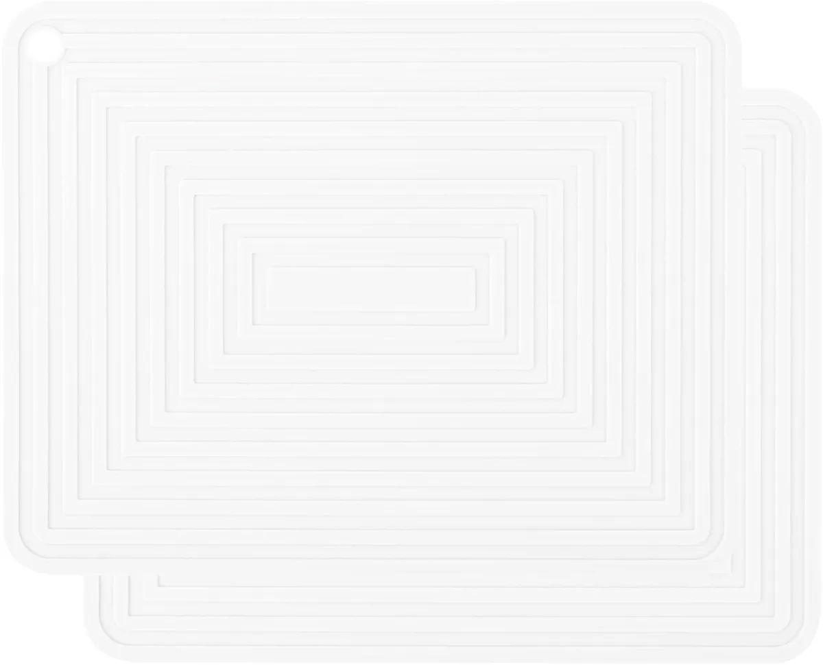 Two white rectangular silicone trivet mats with wavy stripe texture, 11.4 inches long