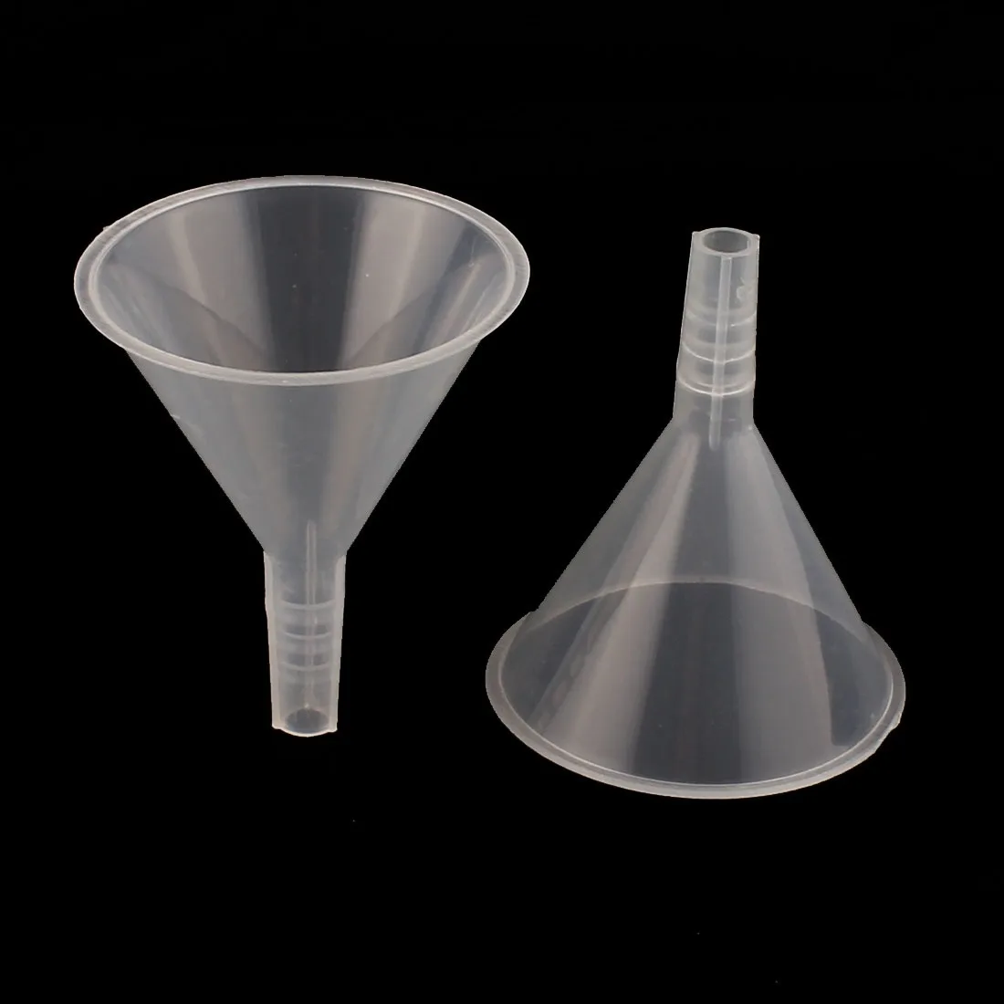 Five clear white plastic funnels with wide mouths and short tips