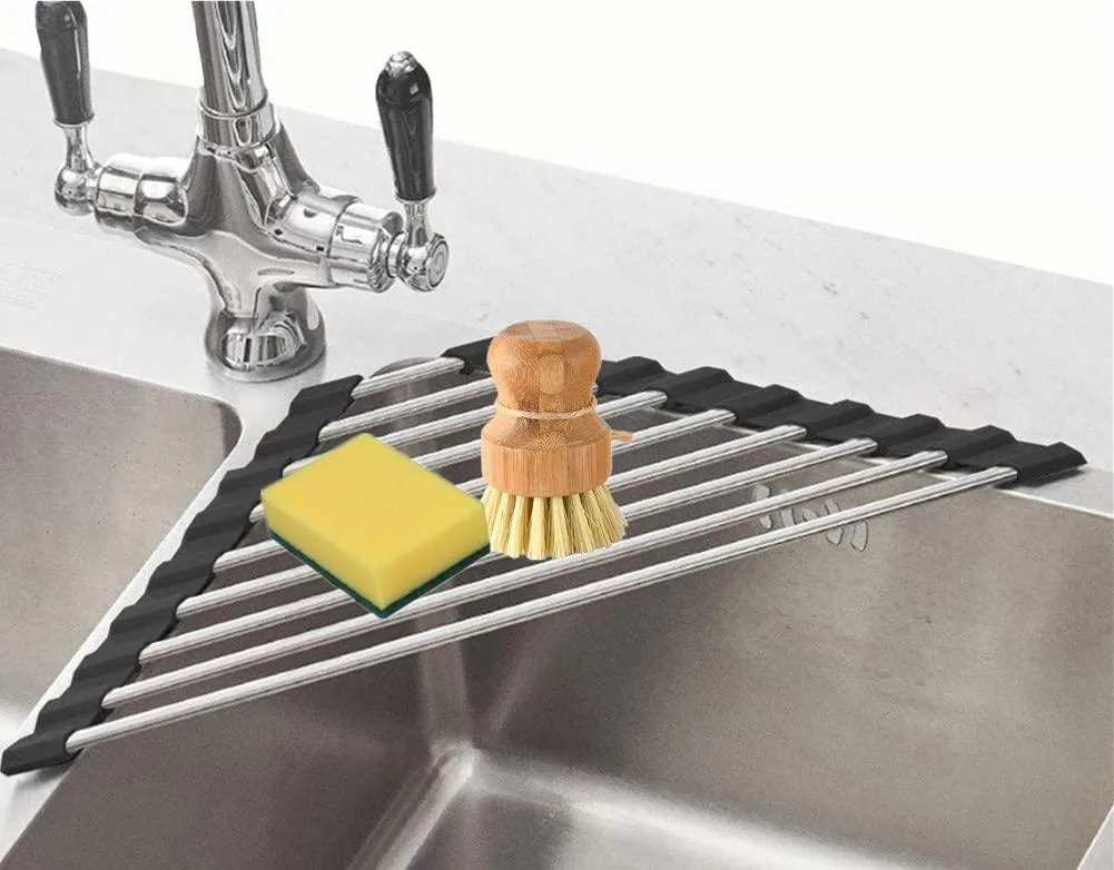 Triangular black stainless steel roll-up rack with silicone edges over a sink corner