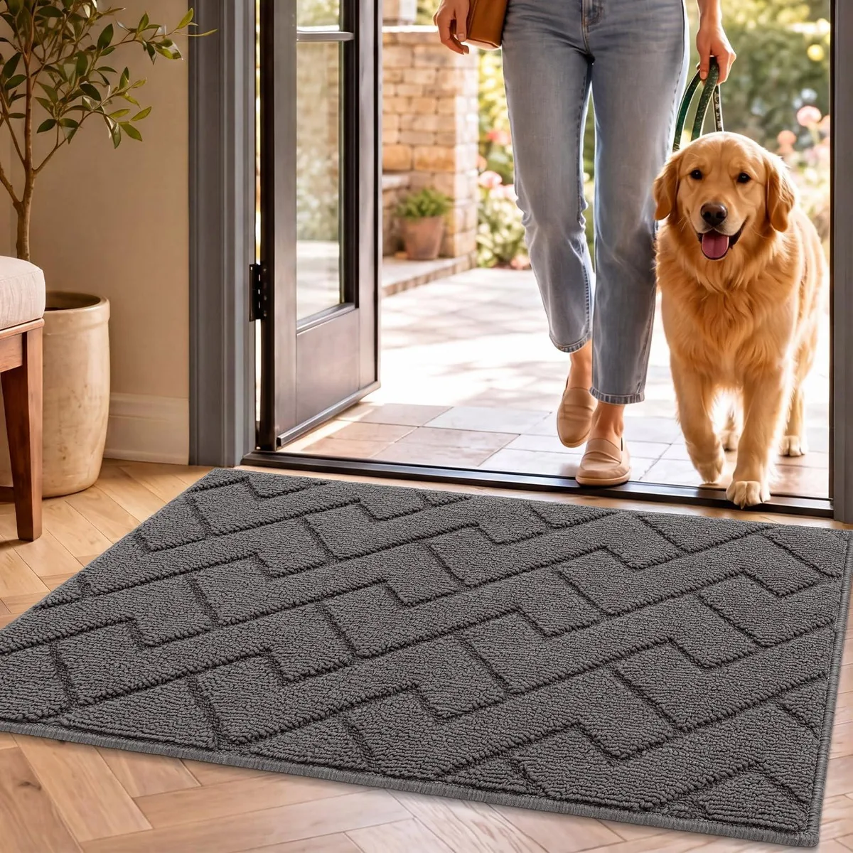Grey rectangular doormat, low-profile woven surface, non-slip backing, 20 by 32 inches