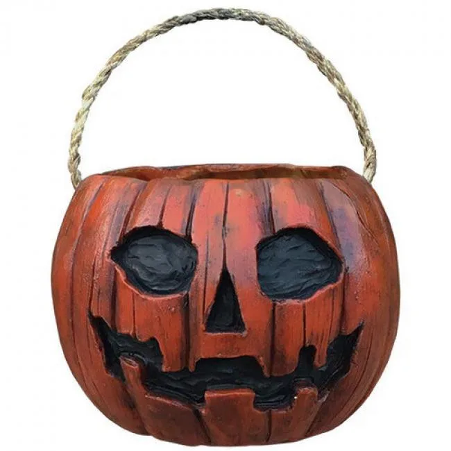 Orange pumpkin pail prop with candy corn texture and rope handle