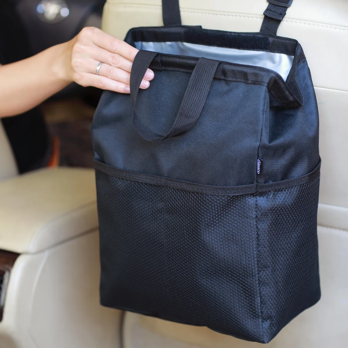 Three white 3.5 gallon leak-proof bags with hook-and-loop lids, handles and mesh pockets
