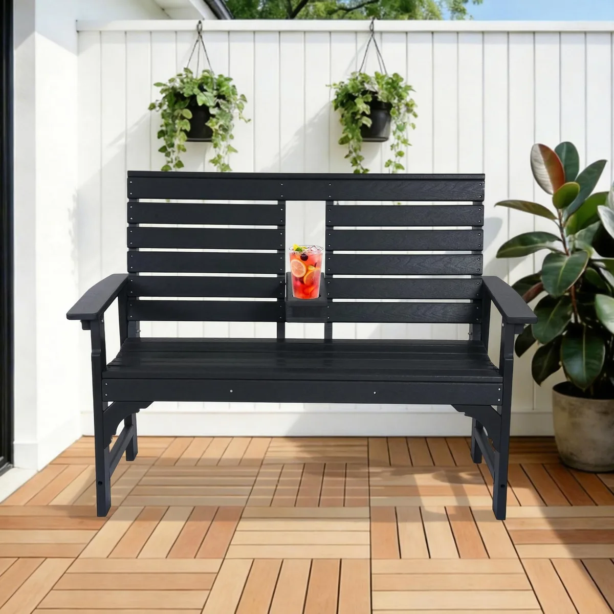 Light brown HDPE patio bench with wood grain texture, fold-down cup holder on backrest, reinforced crossbars, two-seat design