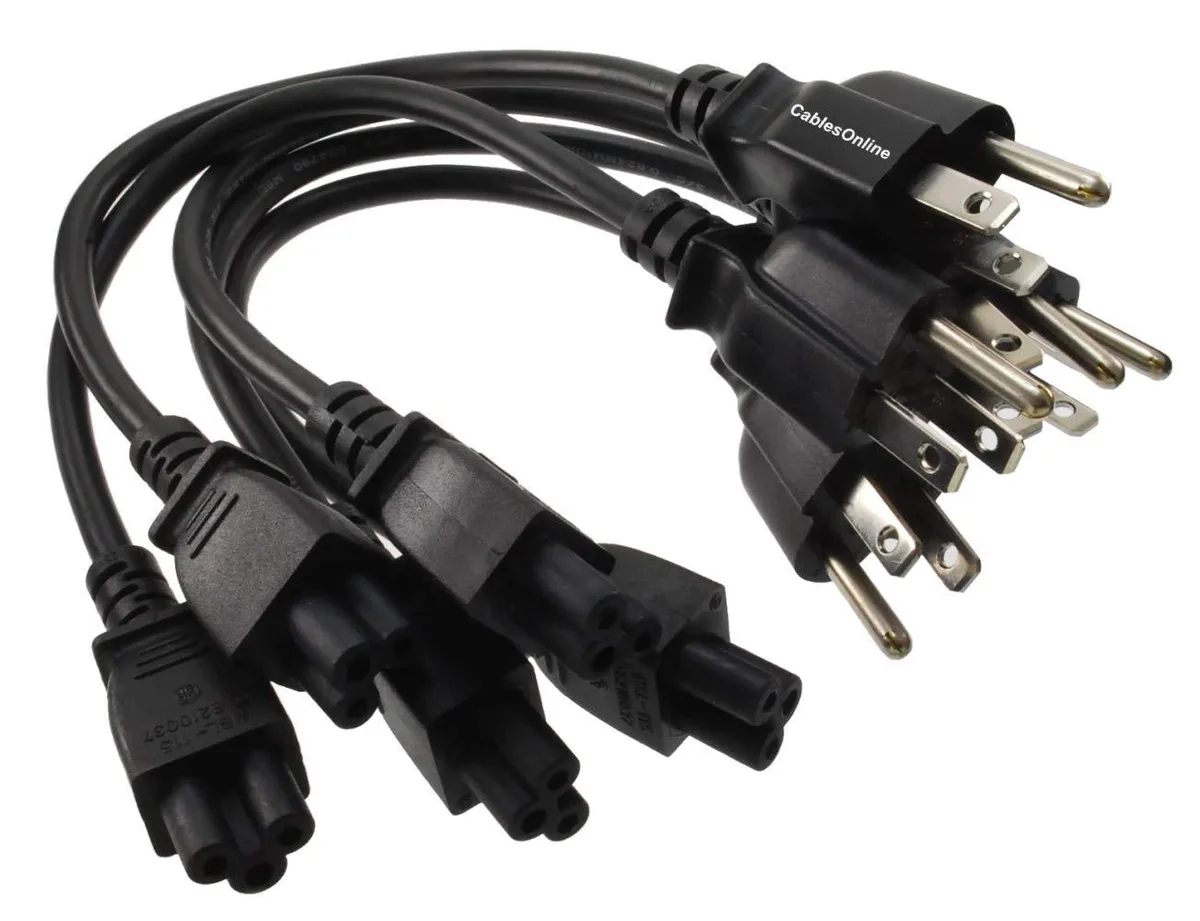 Five short black power cords with clover-shaped connectors lying coiled