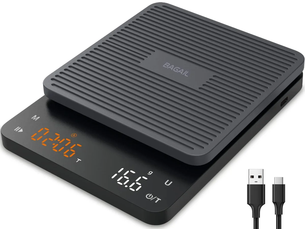 Black rectangular coffee scale with timer display, USB-C port, silicone pad, and 12-unit pack visible