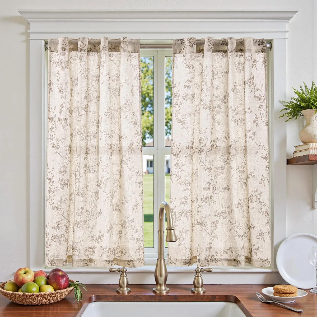 Two taupe linen-blend curtain panels with botanical floral print and back tabs