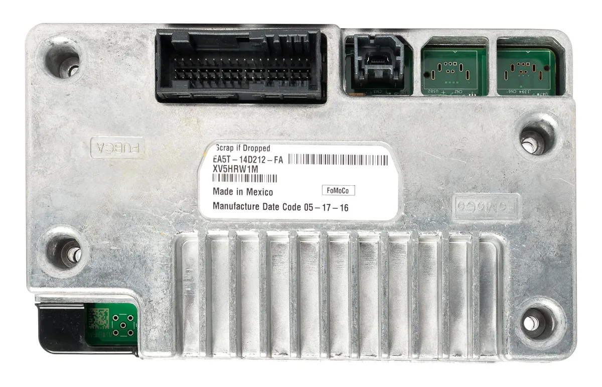 Small black plastic electronic module with connector port and part number label