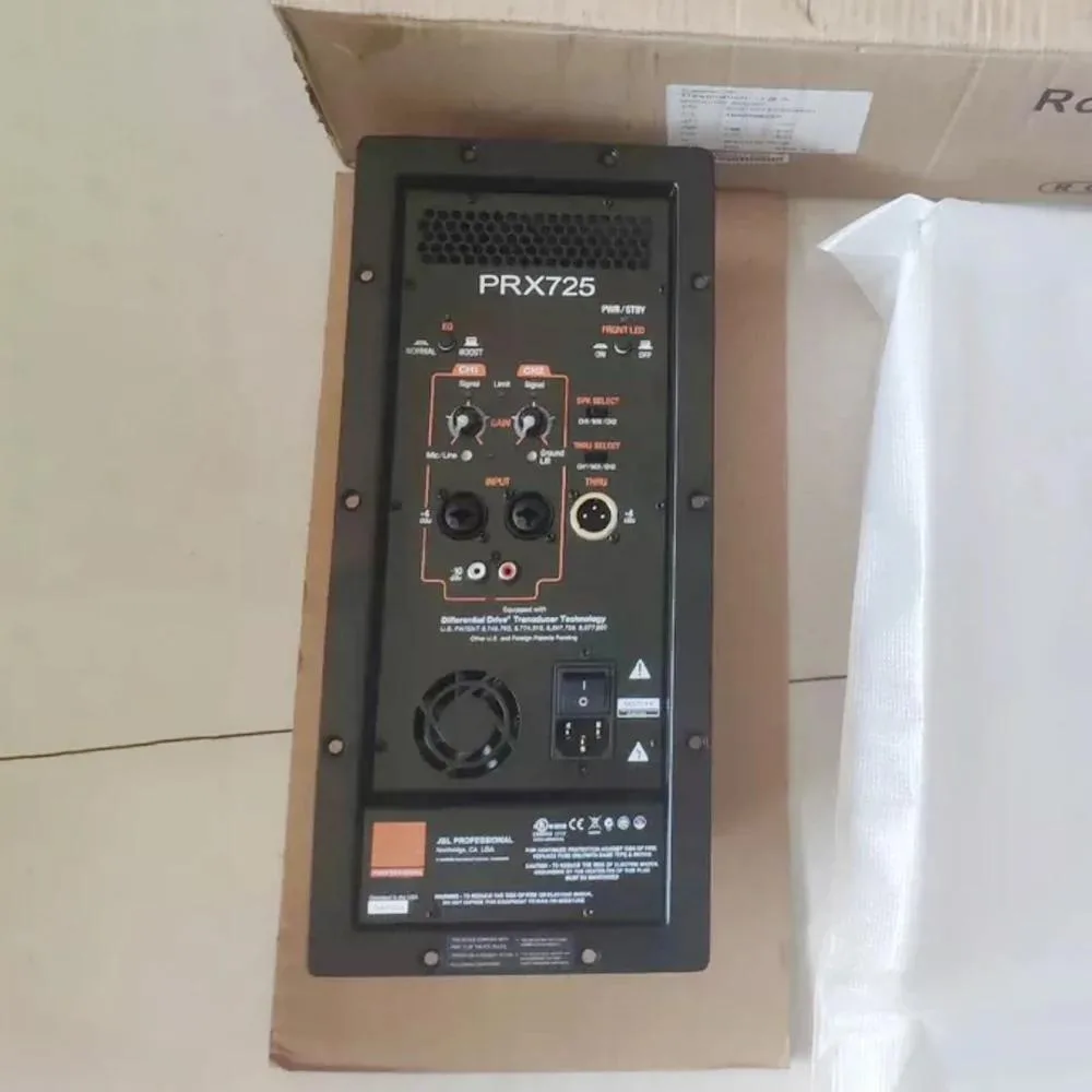 Rectangular ATX power supply unit with metal casing and label showing PRX 725