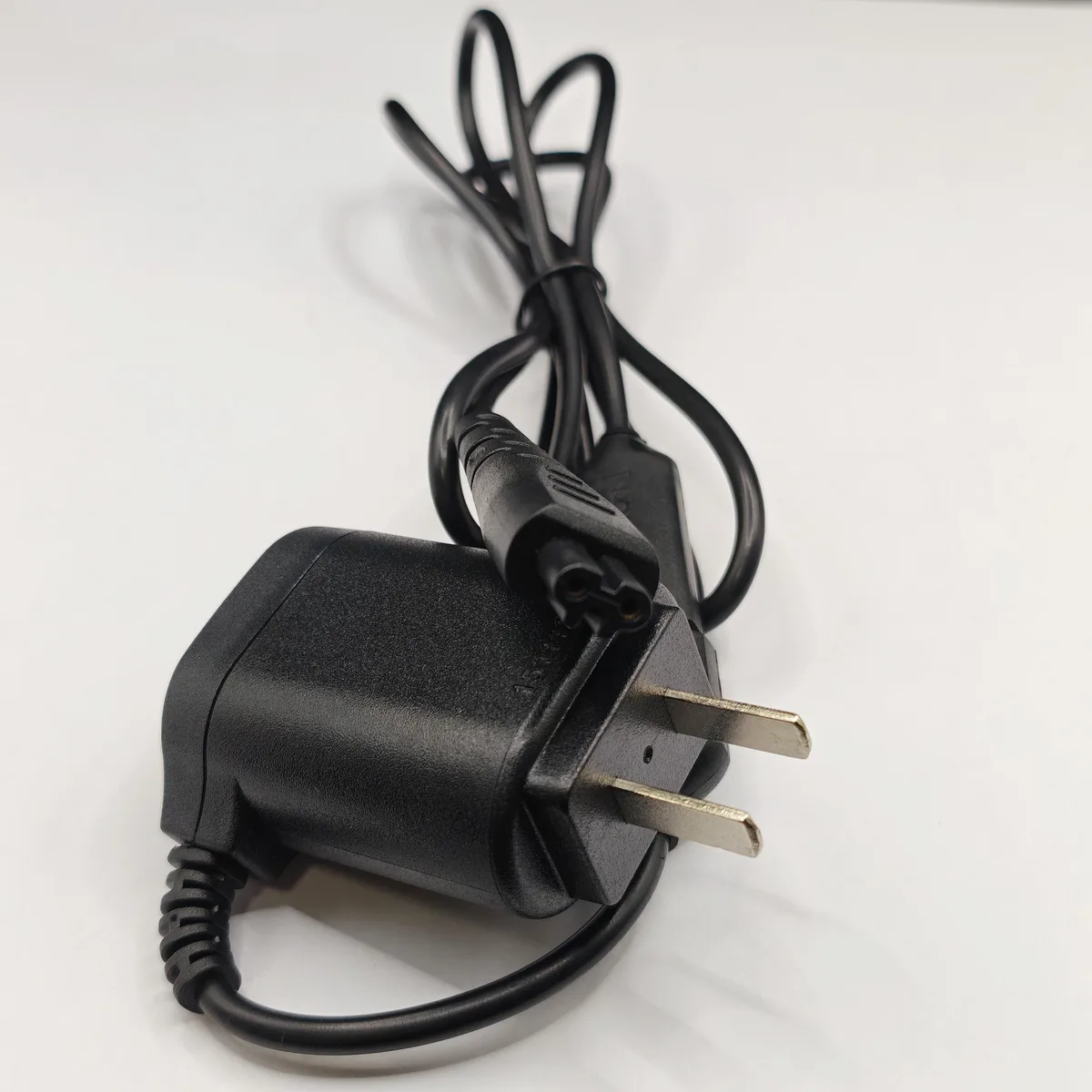 Black rectangular shaver charger power supply with rounded edges