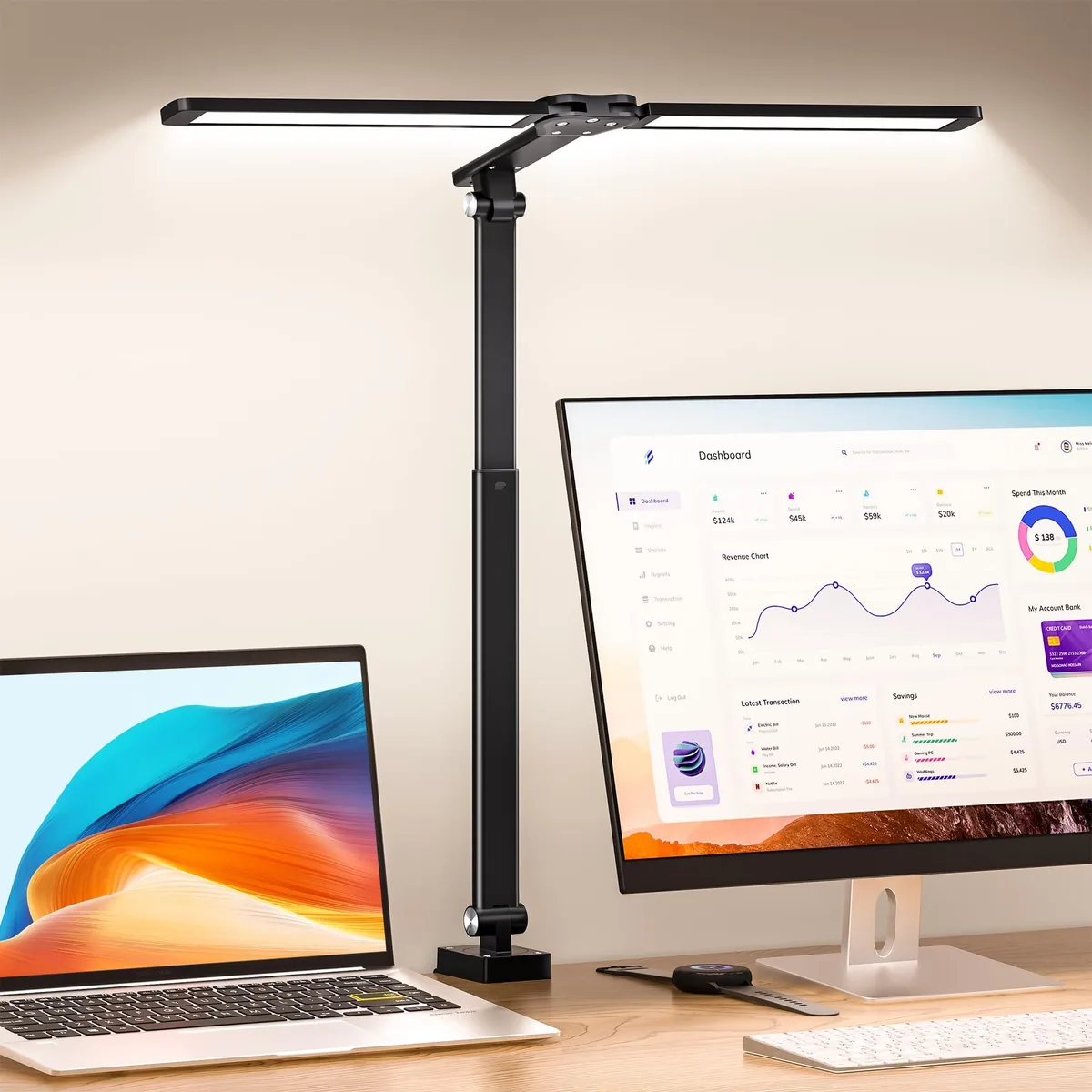 Black dual swing-arm desk lamp with clamp base, polished finish, two adjustable heads
