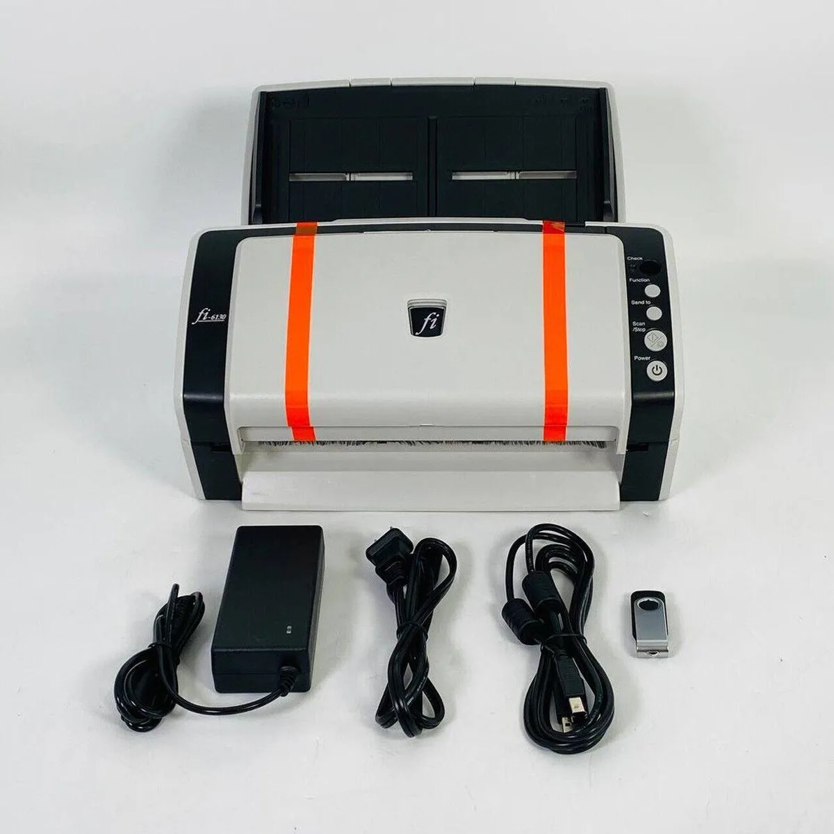 Compact grey sheet-fed document scanner with automatic feeder tray and USB port