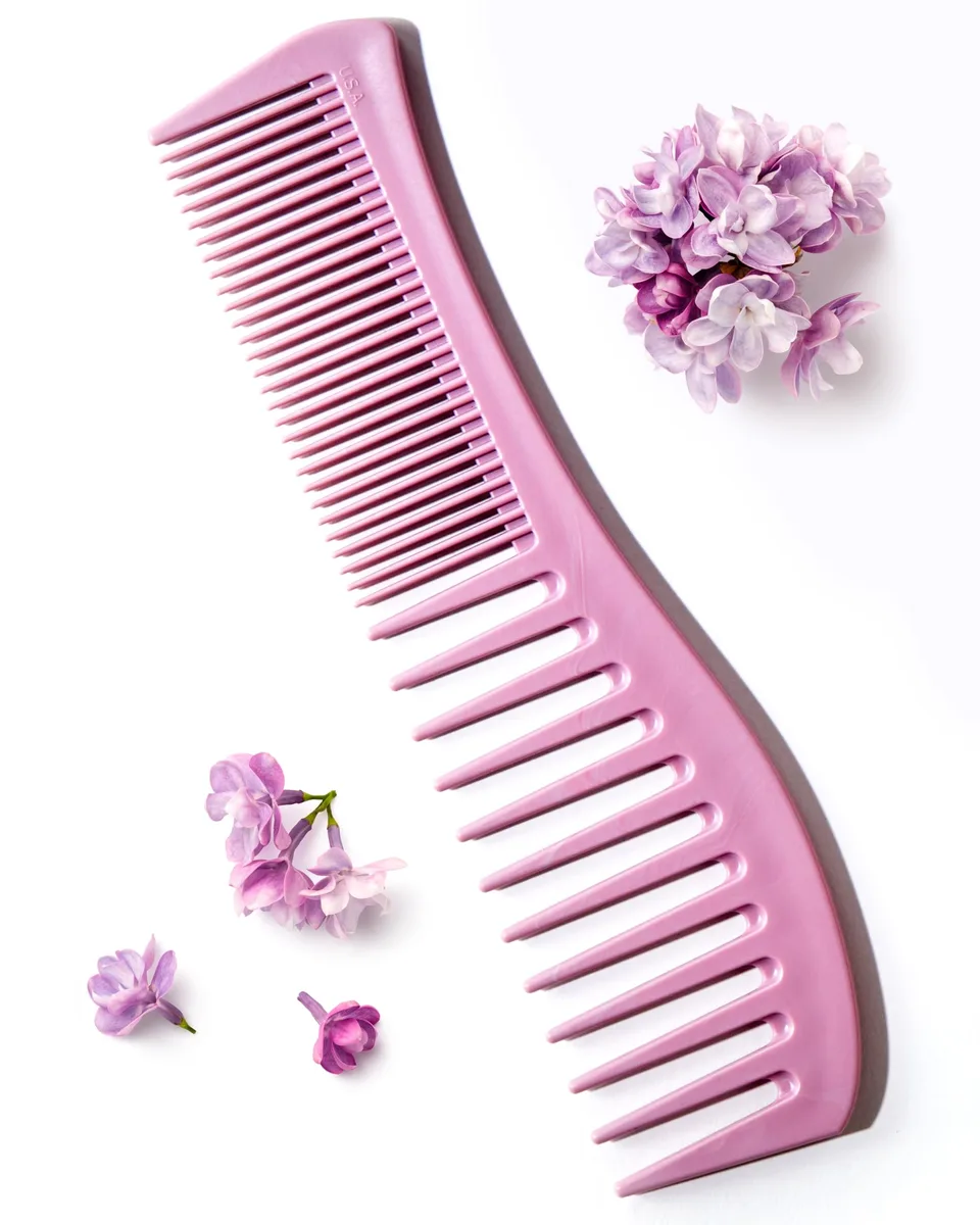 Two-sided plastic detangling comb with wide and fine teeth
