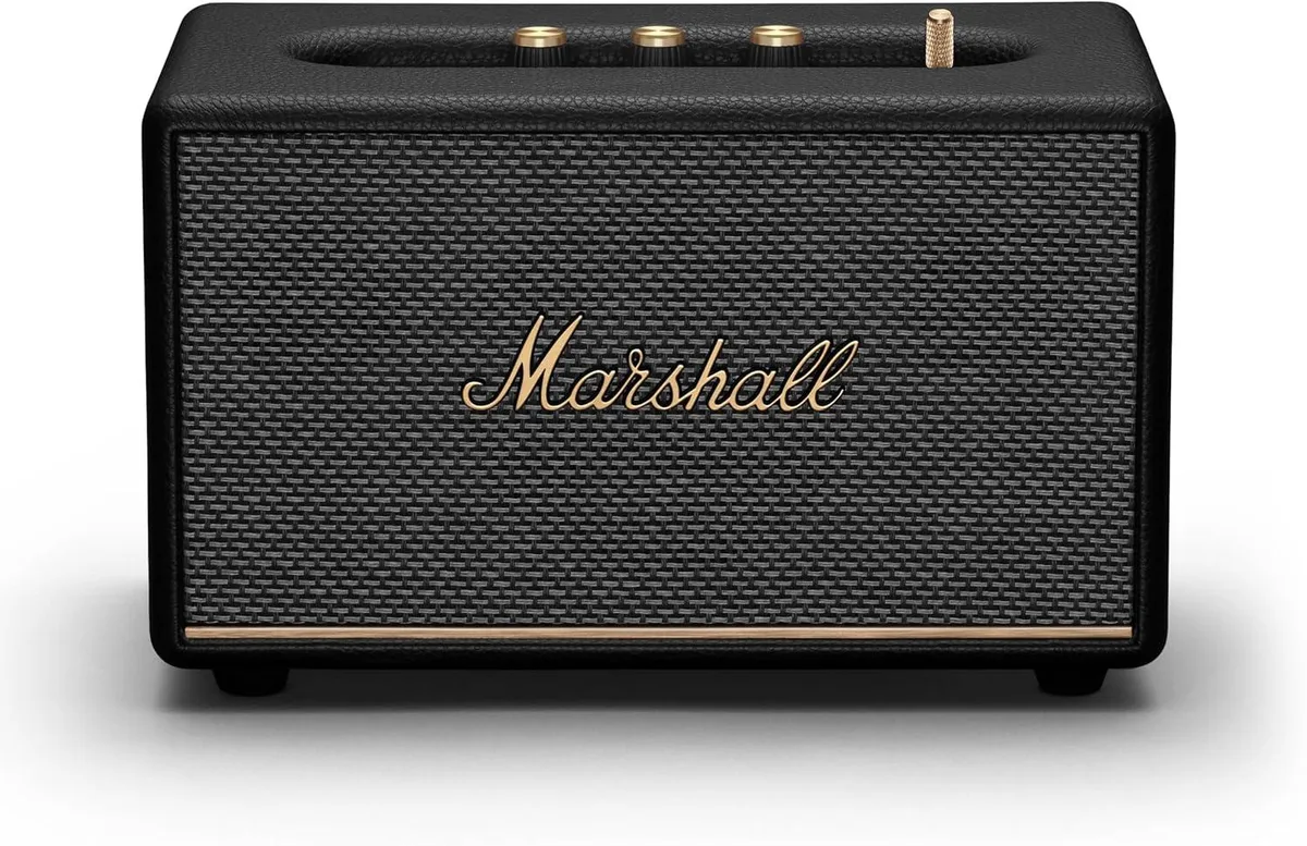 Marshall Acton III Bluetooth speaker in black, rectangular boxy shape with textured vinyl finish and brass control knobs on top