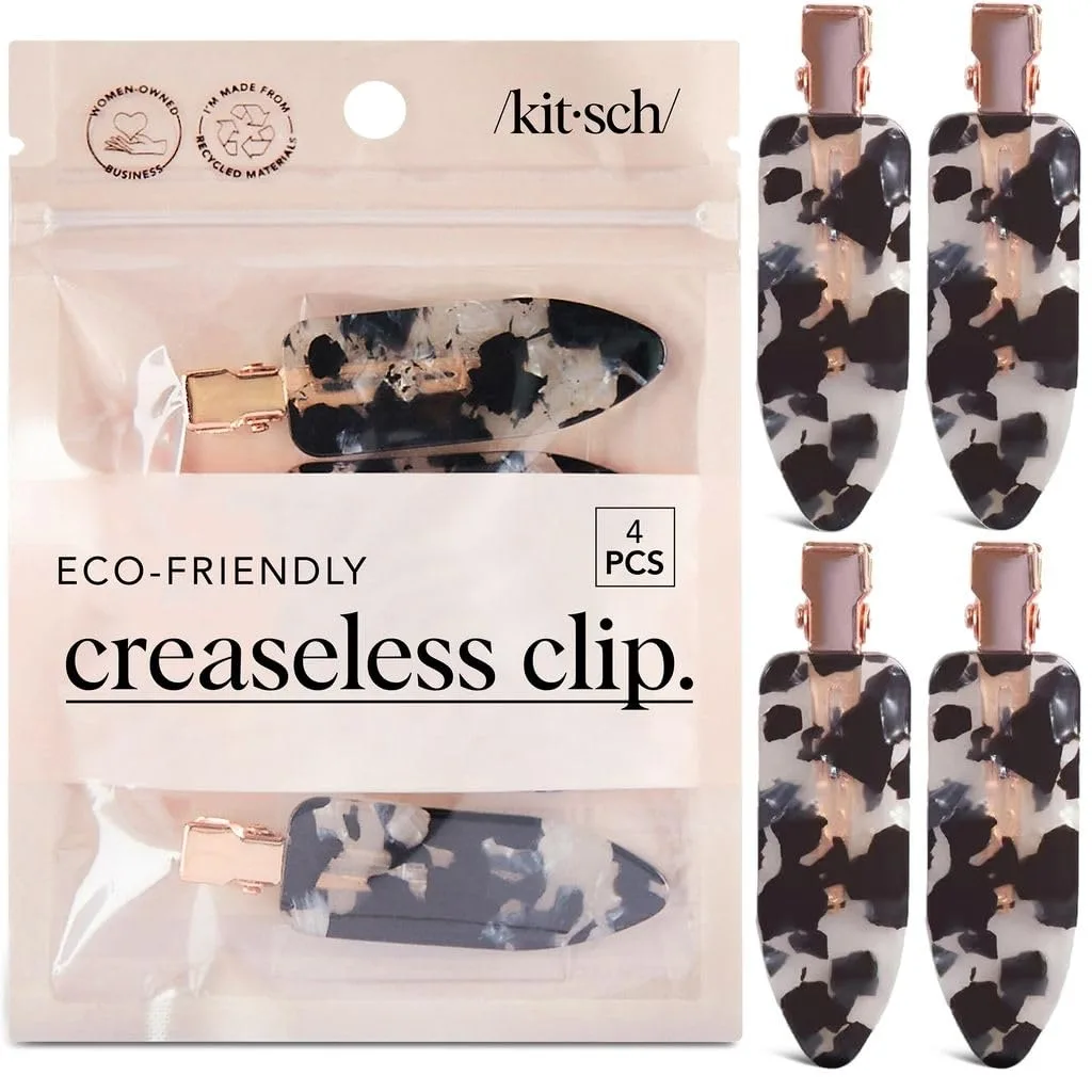 Four rectangular black terrazzo hair clips with glossy finish