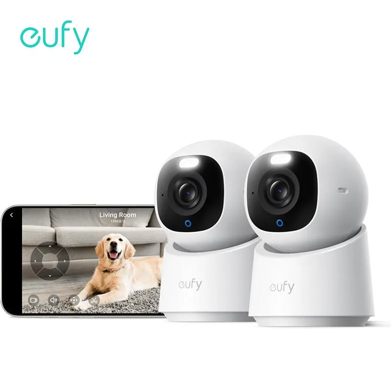 Two white indoor cameras with pan-tilt heads and built-in spotlights
