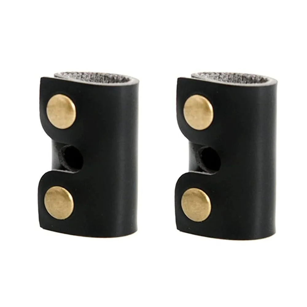 Two black leather safety razor covers with button closures