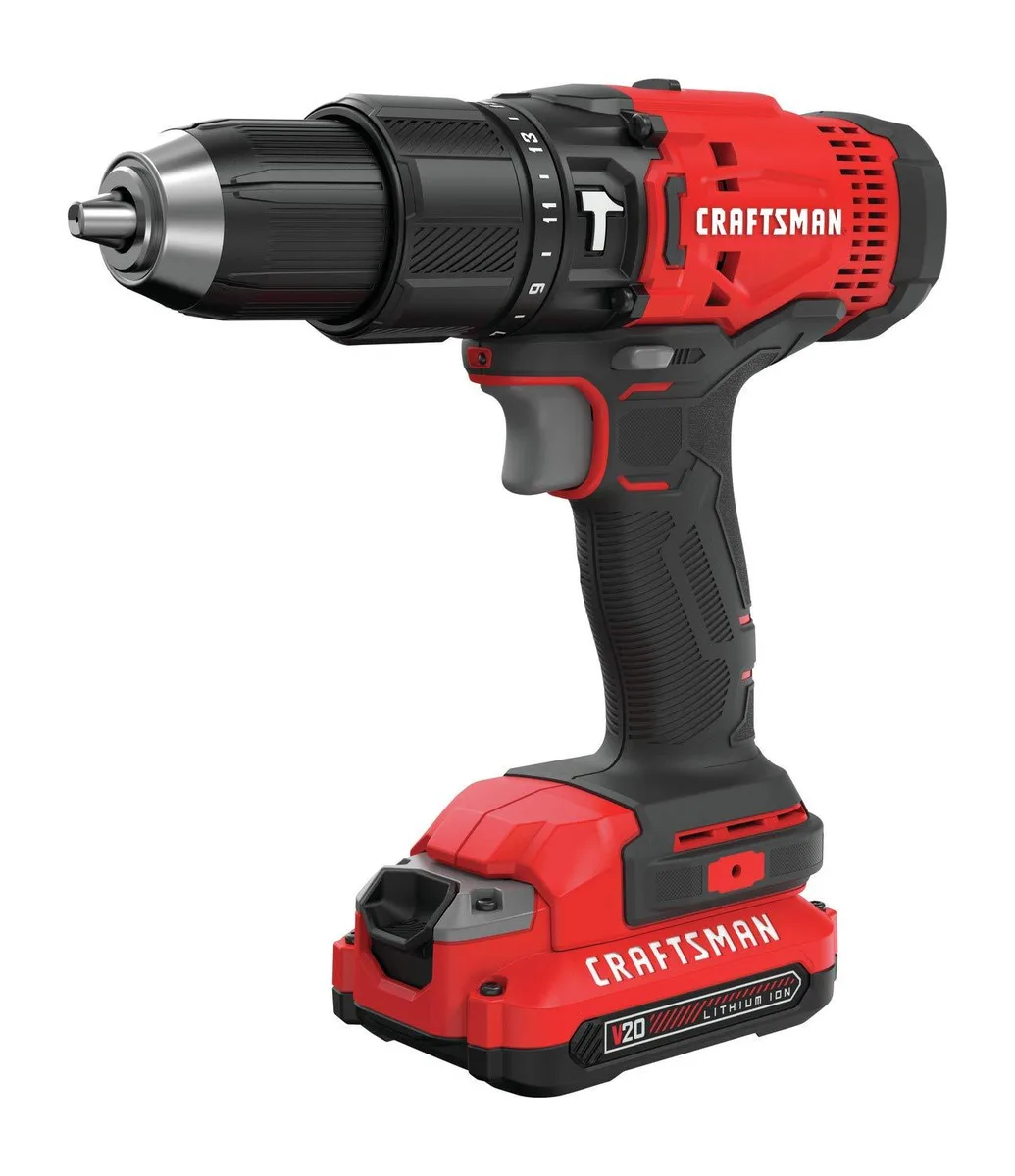 Yellow and black cordless hammer drill with two batteries and charger