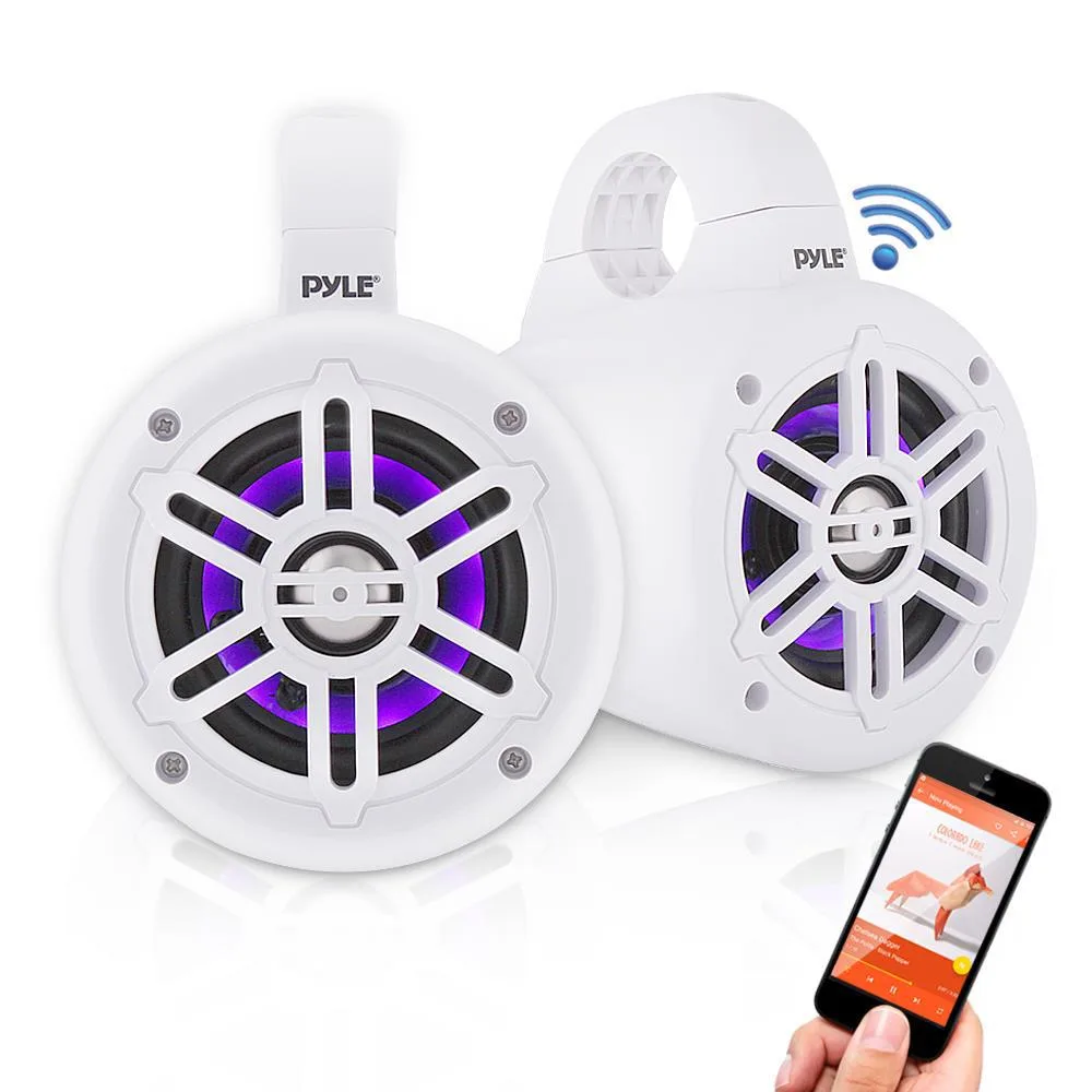 Pair of white cylindrical marine tower speakers with illuminated grilles and integrated mounting clamps