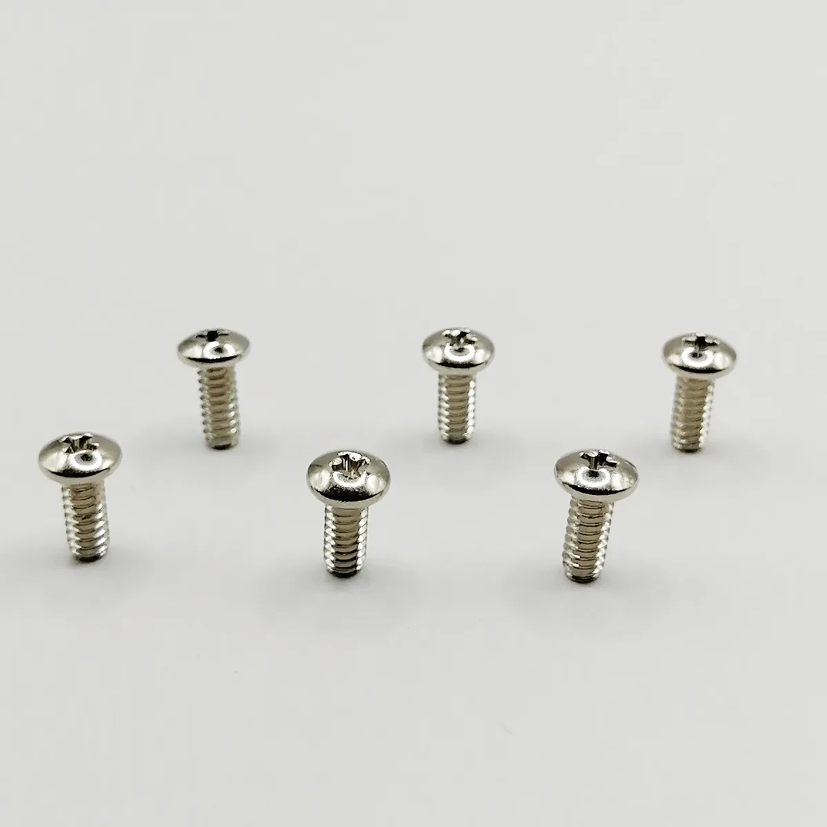 Six silver hinge screw assemblies for clipper repair