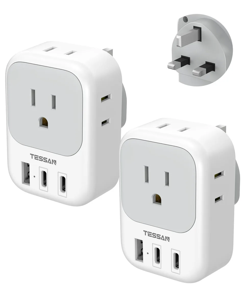 Two black Type G travel adapters each with four AC outlets two USB-C ports one USB-A port